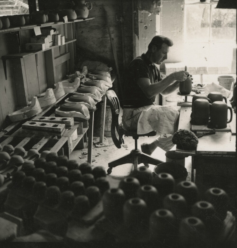 Man makes cups in Heath factory. | Courtesy of the Environmental Design Archives at UC Berkeley