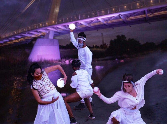Dancers at the North Atwater multi-modal bridge. The performance is part of at "Firefly Nights," an in-person COVID-safe experience that falls within the "Rio Reveals" series.