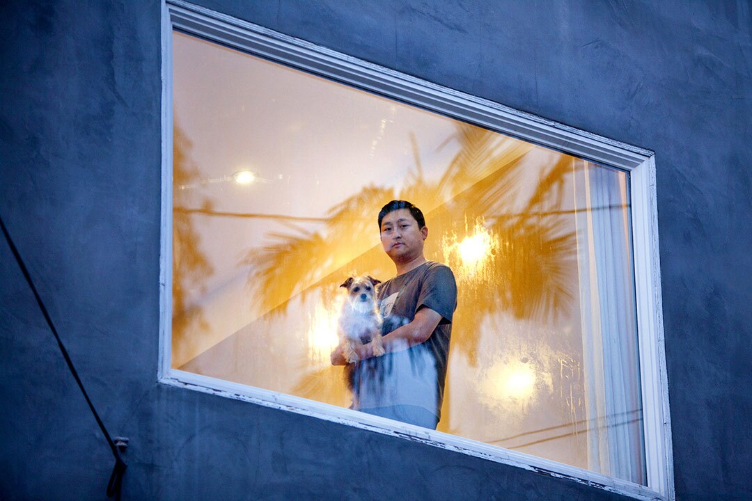 Photographer Sally Ryan snapped pictures of her neighbors with a window separating the camera from the people to symbolize social distancing. | Photographs by Sally Ryan and submitted to the Autry.