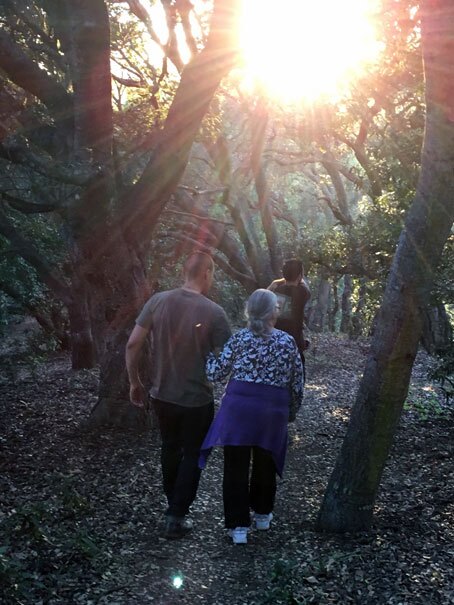 Vincent Medina holds on to an elder during a nature walk. | Courtesy of Vincent Medina