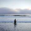 A member of Tolowa Dee-ni' Nation casts his net the beach. | Still from Tending Nature