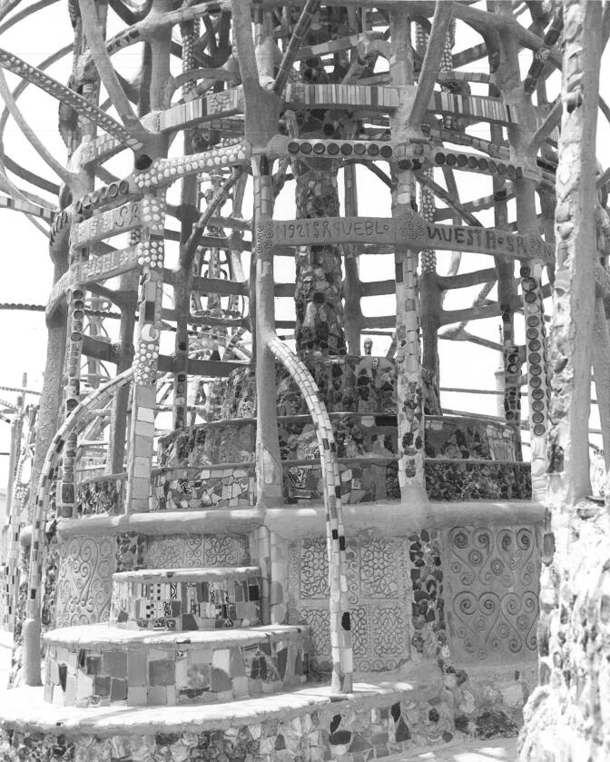 A photo showing damage to Watts Tower C, July 1959