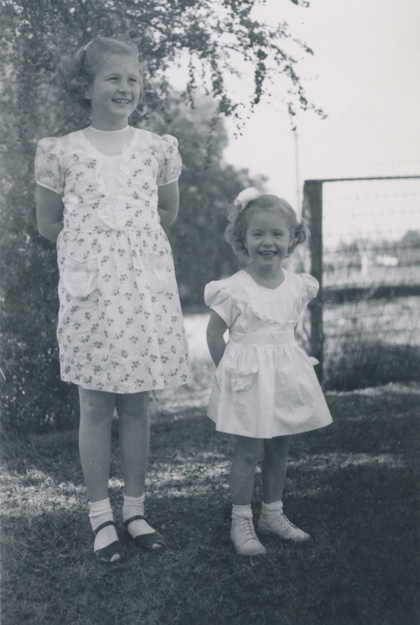 Before her death, three-year-old Kathy Fiscus (right) smiles next to her older sister Barbara (left) for a photo.