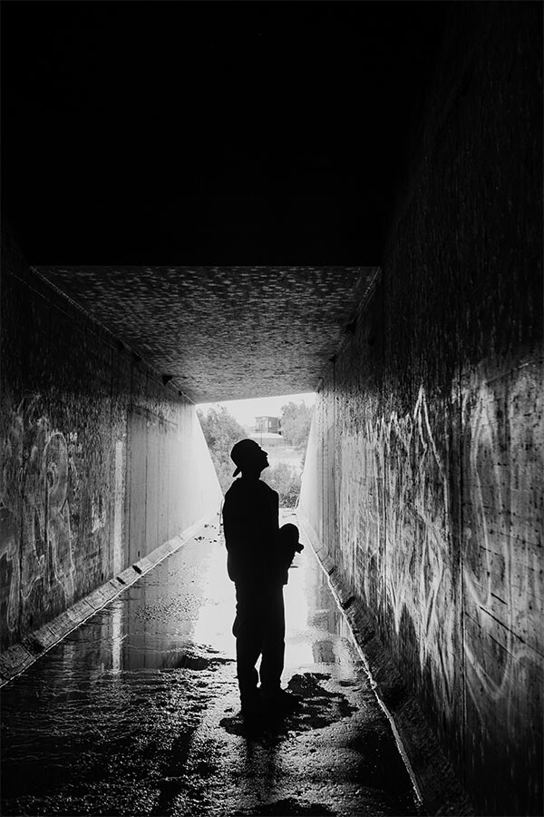 Mykey checks out one of his paintings inside a drainage tunnel along the L.A. River near the Bowtie Parcel | Photo by Bear Guerra