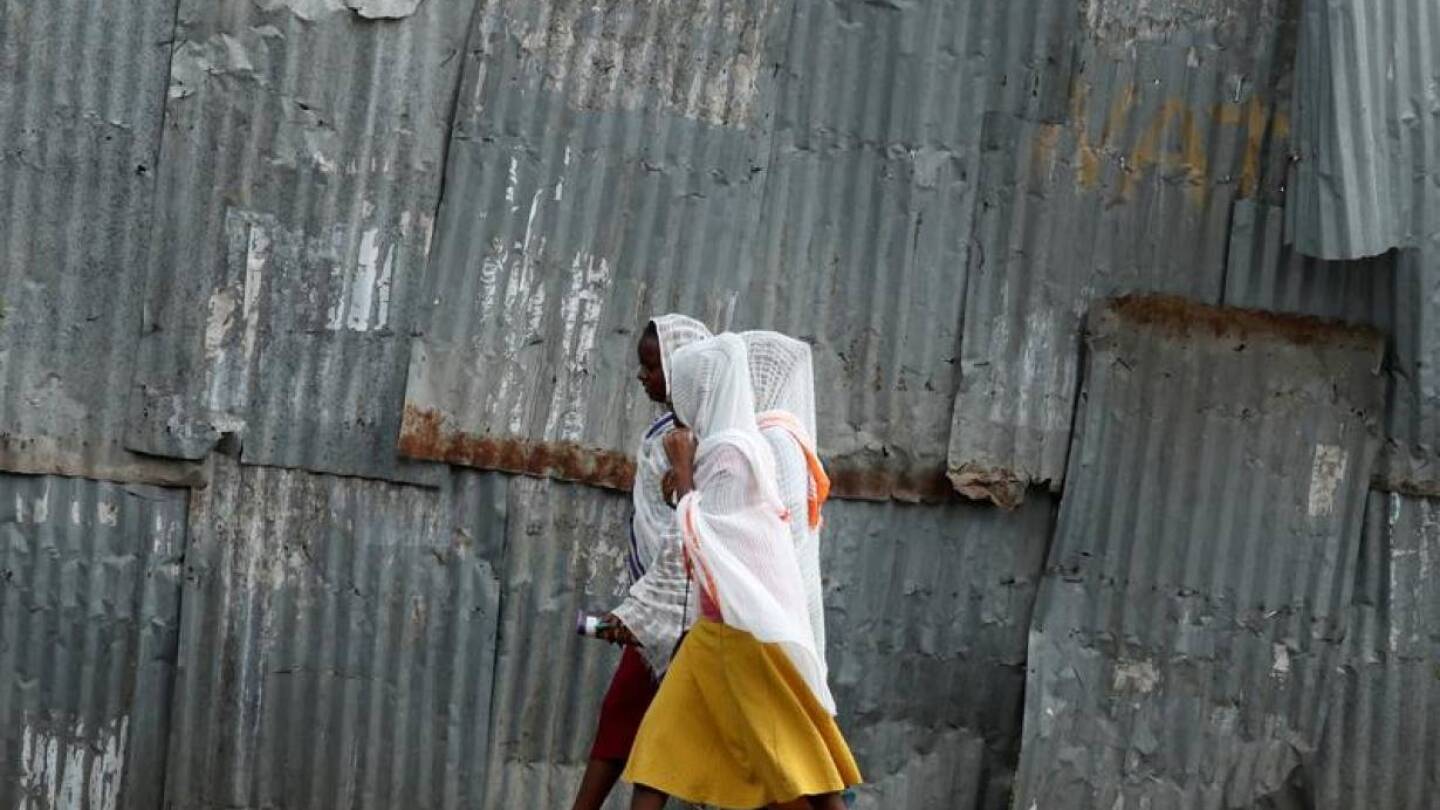 FILE PHOTO: Orthodox women walk along the street to attend a Friday evening prayer in Hawassa, Ethiopia, November 22, 2019. | REUTERS/Tiksa Negeri