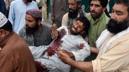 News Wrap: Deadly bombings kill scores at election rallies