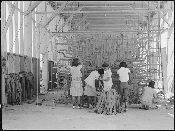 In her performance piece, Tania Candani will reference Japanese American internment in Manzanar. Here, women at the Manzanar Relocation center make camouflage nets. | Courtesy of Wikimedia Commons and the National Archives and Records