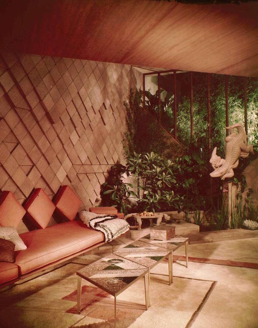 An old, colored photo of a mid-century modern living room.