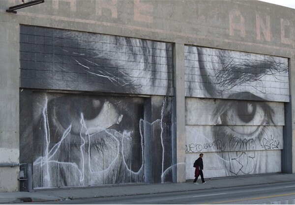 A wheatpaste by French artist J.R. on the side of the Geffen Contemporary at MOCA was defaced by tagging.