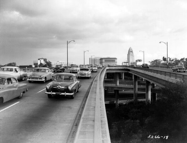 Automobiles on the Hollywood Freeway crossing the top level of the interchange in 1953. Courtesy of Caltrans.