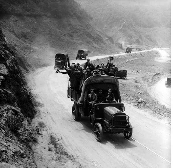 Young men riding in army trucks to go up into the mountains behind Azusa for the purpose of reforestation | Photo Courtesy of the Los Angeles Public Library