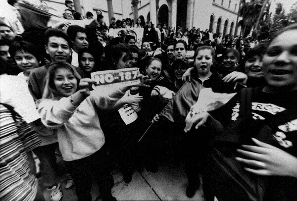 A group of young activists protest Proposition 187, which would deny benefits to illegal immigrants.