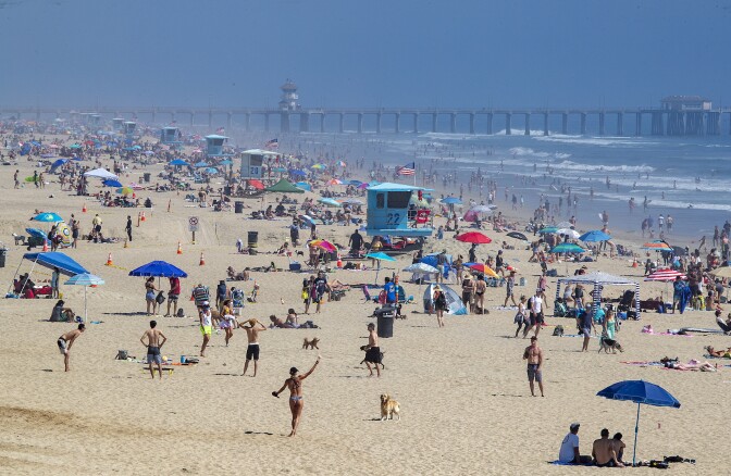 Beach in orange county crowded with people