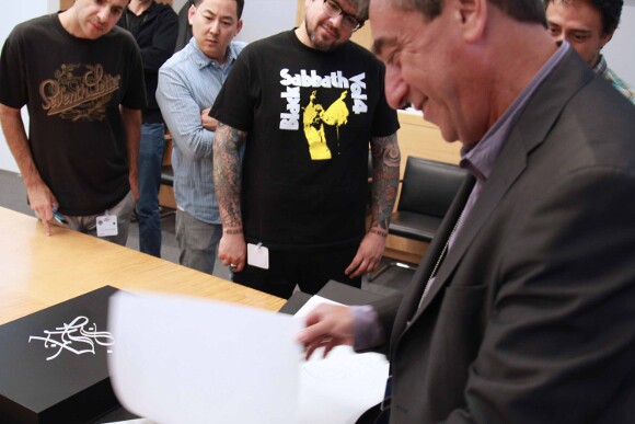 Look, Push, and Axis watching the pages of "L.A. Liber Amicorum" turned by rare book curator David Brafman. The book size is 32 x 50 cm. | Photo: Ed Fuentes