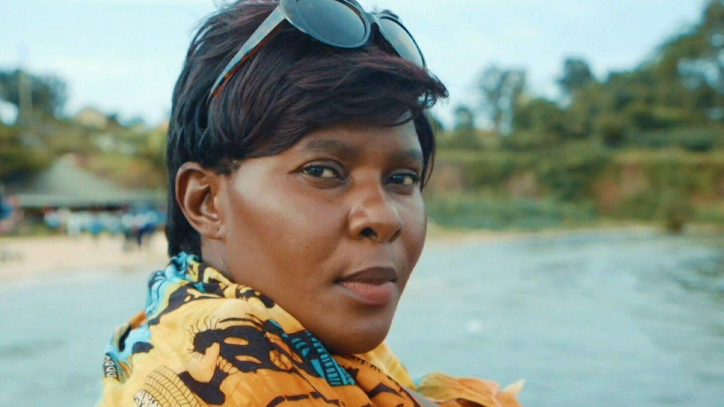 Close-up shot of a woman by the ocean. | From "Witness: Uganda's Lady Justice"