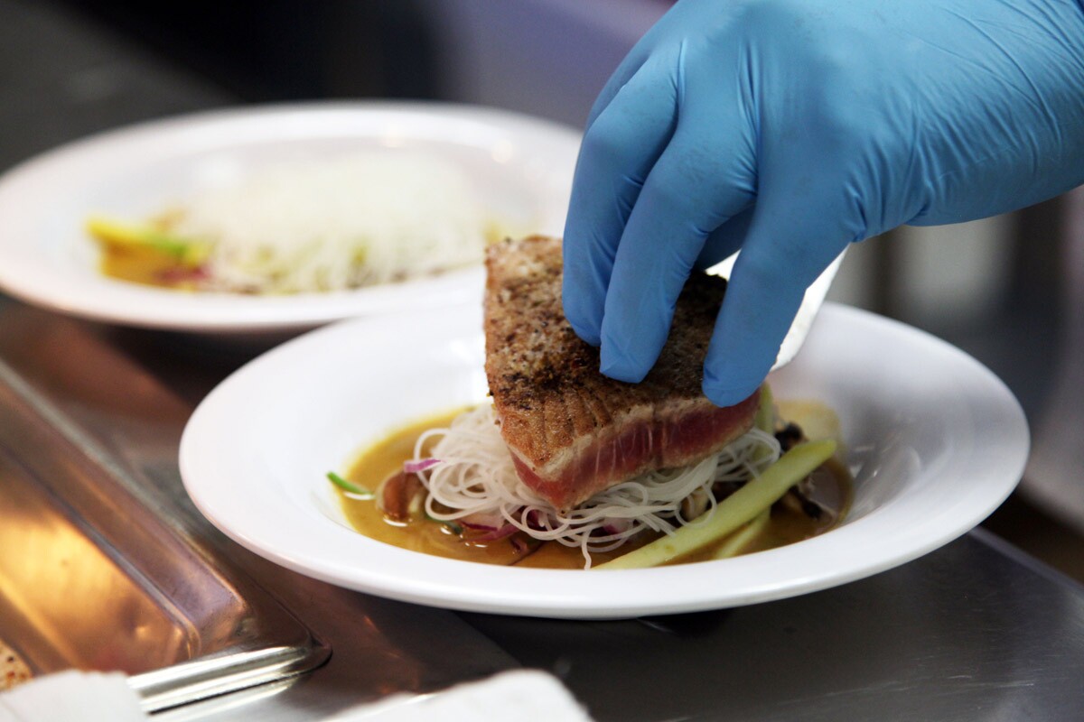 Emily Dolloff plating the seared tuna