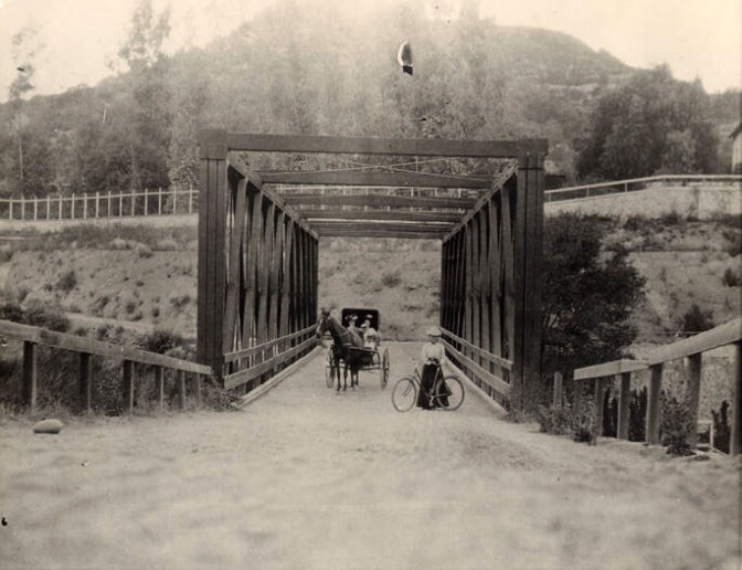 The Scoville Bridge, seen here in 1889, traversed the stream of the Arroyo Seco but still required travelers to descend into the ravine and then climb the opposite bank after crossing. Courtesy of the Pasadena Museum of History.