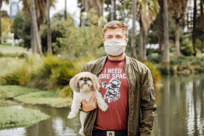 Chris Bedford takes precautions when approaching people, but will generally smile and have a socially distant conversation with folks. | Chava Sanchez/LAist