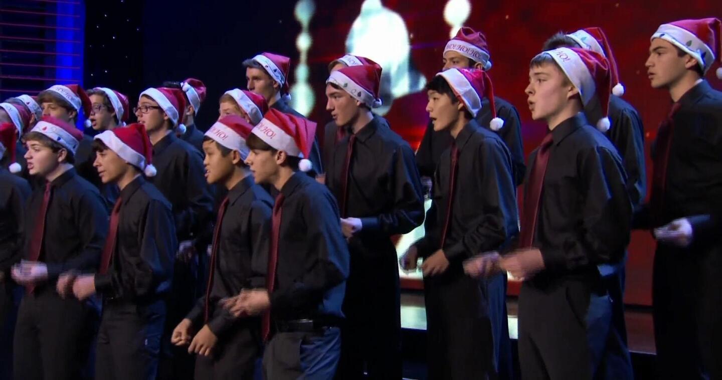 Choir members wear Santa hats as they sing a song. | From "The 60th Annual L.A. County Holiday Celebration"