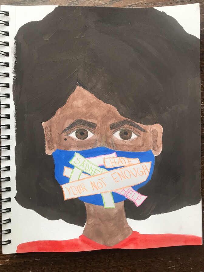 A young woman of color wears a pandemic face mask with messages that read "You’re Not Enough," “Hate" and “Sadness."