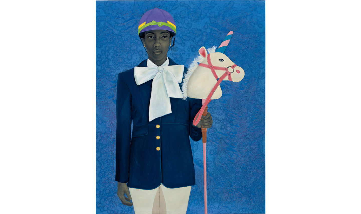 A Black woman in a horse jockey outfit holding a toy unicorn head on a stick meant to ride.