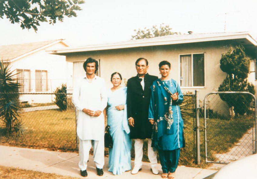 Syed and Qaiser with their children Qamar and Faozia in front of a home in Los Angeles. | Shades of L.A. Collection / LAPL