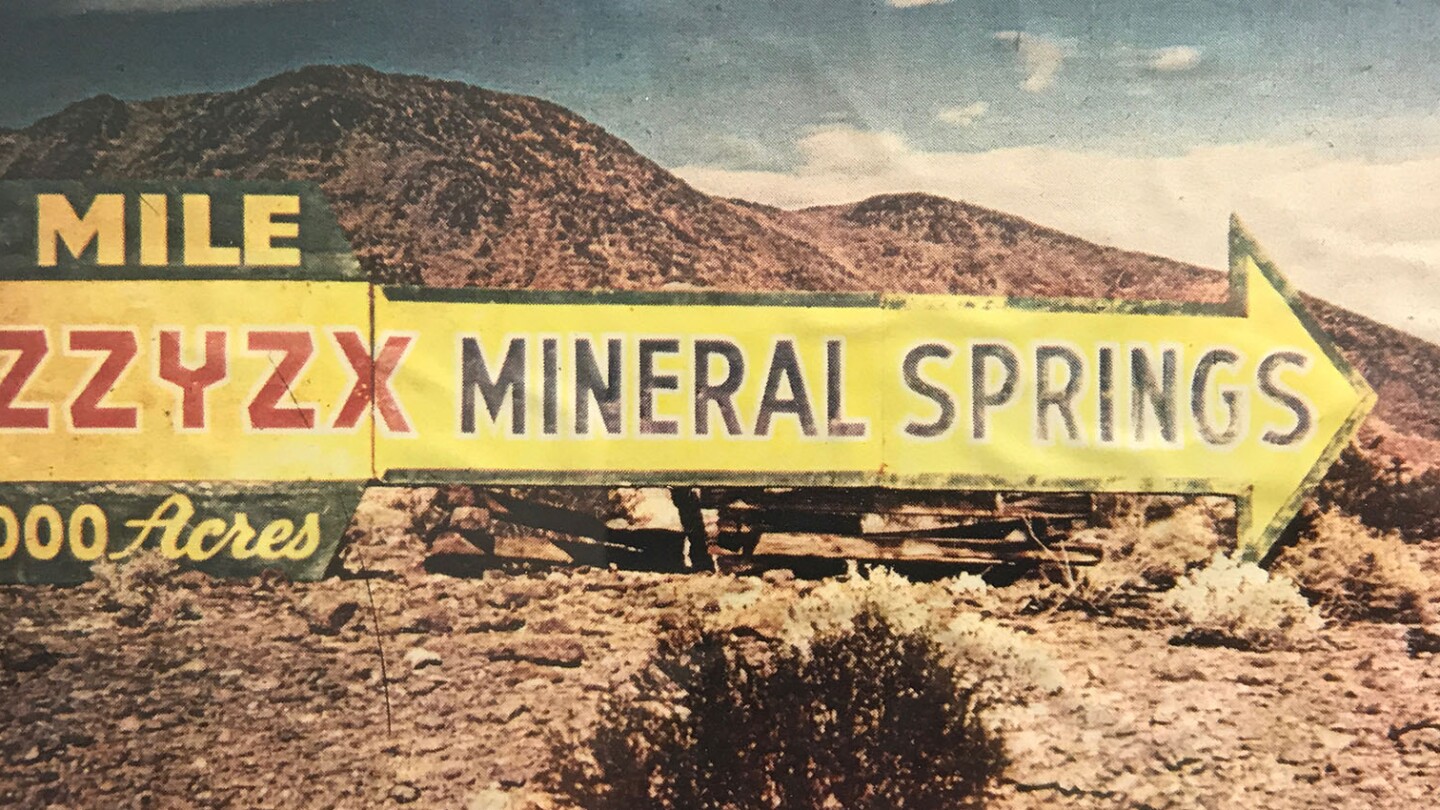 A roadside sign pointing the way to Zzyzx | Jason Wallace/CSU Desert Studies Center