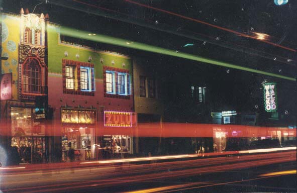 The WACKO/Soap Plant storefront on Melrose Avenue taken at night. Light streaks go across the frame.