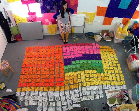 YBLA-er Carol Zou lays out granny squares. | Photo courtesy of YBLA.