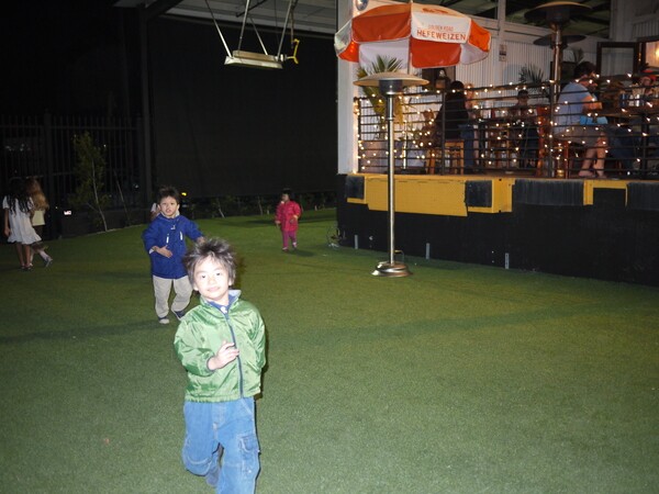 James' children running around on the artificial grass right in front of the pub | Photo by George Villanueva