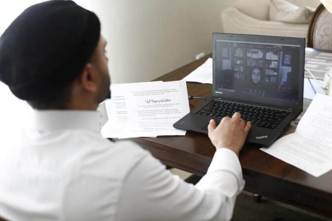 Umair Khan, the Imam of the largest mosque in British Columbia, the Baitur Rahman Mosque, participates in a virtual Iftar dinner during the holy fasting month of Ramadan amid coronavirus disease (COVID-19) restrictions in Delta, British Columbia, Canada April 25, 2020.