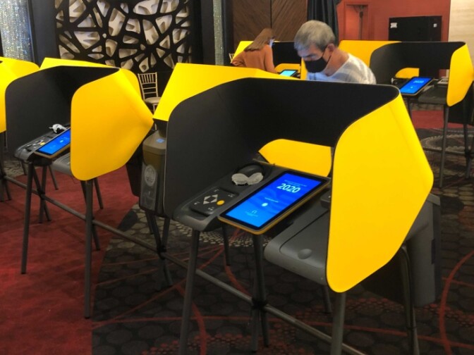 Voters cast their ballots at the Impressions Banquet Hall in Glendale, which has been closed due to the pandemic. Its owner volunteered the location for the first time, and says he will do so again in the future. | Mike Roe/LAist
