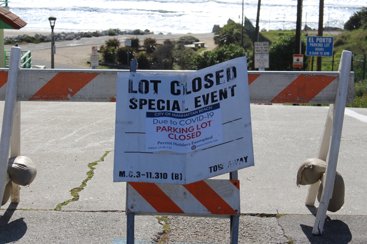Close up of signage saying beach closed because of COVID19