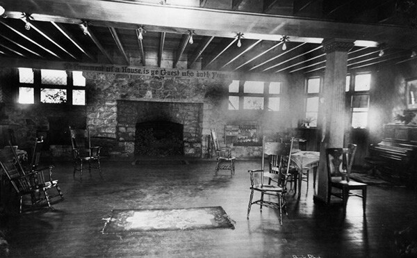Interior view of Ye Alpine Tavern showing a very large lounge room with a fireplace, chairs and a piano on the right. | Courtesy of the Los Angeles Public Library