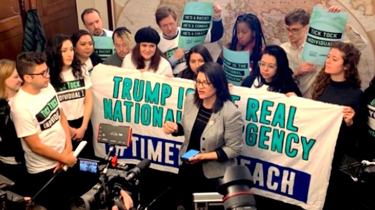 Demonstrators calling for impeachment of Trump. | Still from "Democracy Now!"