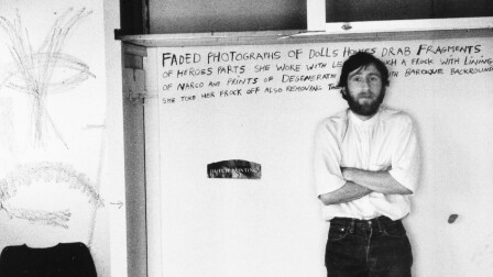 A man in a white shirt in front of a whiteboard | Still from Lost LA Season 3 Venice of America