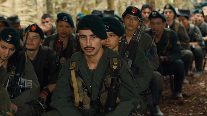 Colombian soldiers sit in many rows. | From "To End a War"