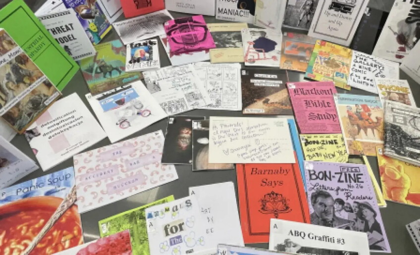 The Emergence of the Queer Zine in Los Angeles, photo of 10-20 zines laid out on a table 