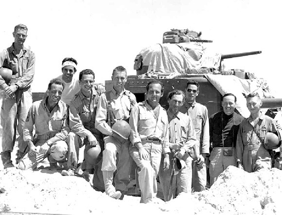 Filmed in and near the Desert Training Center, Sahara not only featured Humphrey Bogart (kneeling at left) but also members of the 4th Armored Division who trained at the DTC. | Courtesy of Eve's Magazine and Kenneth Koyen.