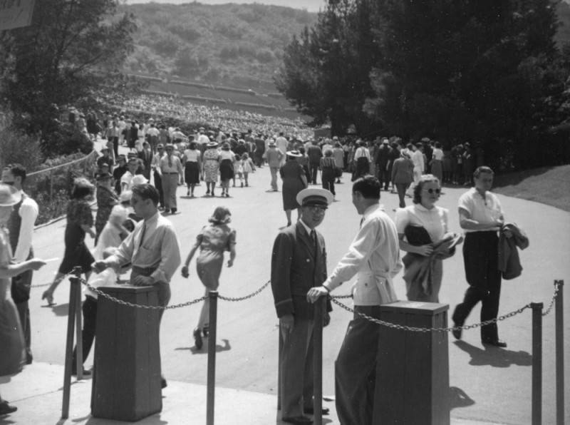 Patrons climbing up the hill to the Hollywood Bowl with their tickets on hand.