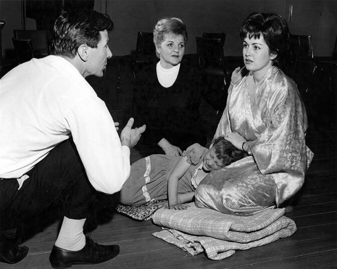 Artistic Director puts final touches on a scene in "Puccini's "Madama Butterfly' with, from left, Katherine Hilgenberg, Carol Todd and little Janet Brown. | Opera Scene Valley Times Collection/ LAPL Photo Collection