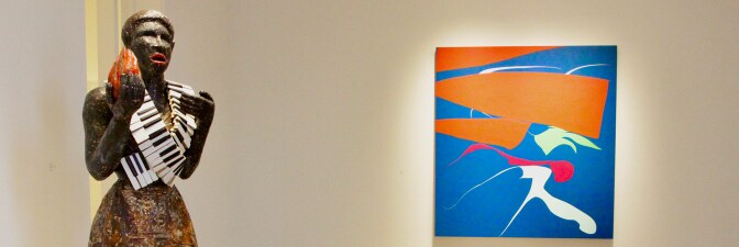 Alison Saar’s “Torch Song,” 2020 in wood, copper, ceiling tin, enamel paint, leather belts and vintage piano keys (72 x 22 x 26) next to Heather Gwen Martin’s “Touch” from 2020. Oil on linen, 60 x 56 in. | Jordan Riefe