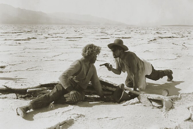 McTeague (Gibson Gowland) and Schouler (Jean Hersholt) brawl it out on the Death Valley’s salt flats in Erich von Stroheim’s 1924 silent film classic, Greed. Turner Entertainment.
