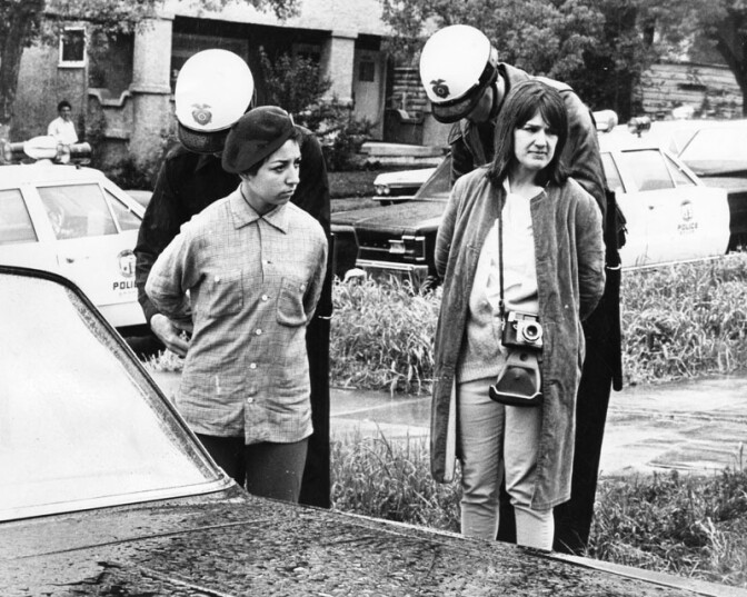 Police handcuff a Brown Beret and photographer from the Free Press outside Belmont High School, March 8th 1968. Photo Courtesy of the Los Angeles Public Library