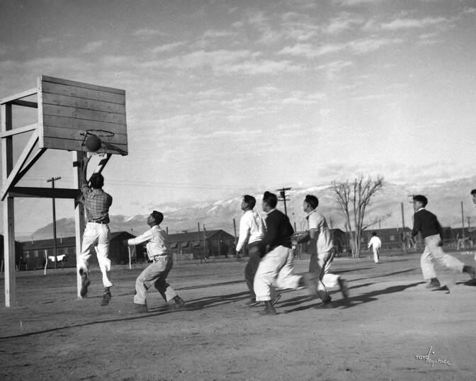 Japanese American men playing basketball at Manzanar