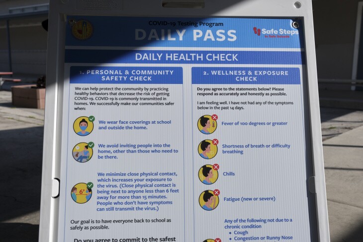 A daily health checks sign.
