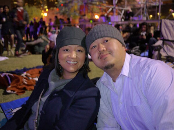 Northridge residents Gerlie Collado and Joe Bernardo picnic in the Grand Park lawn in front of City Hall