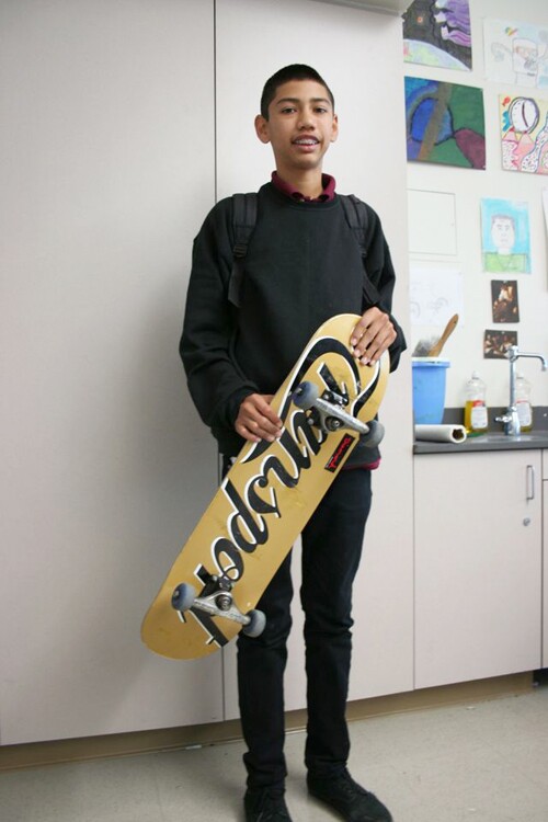 A young man and his skateboard