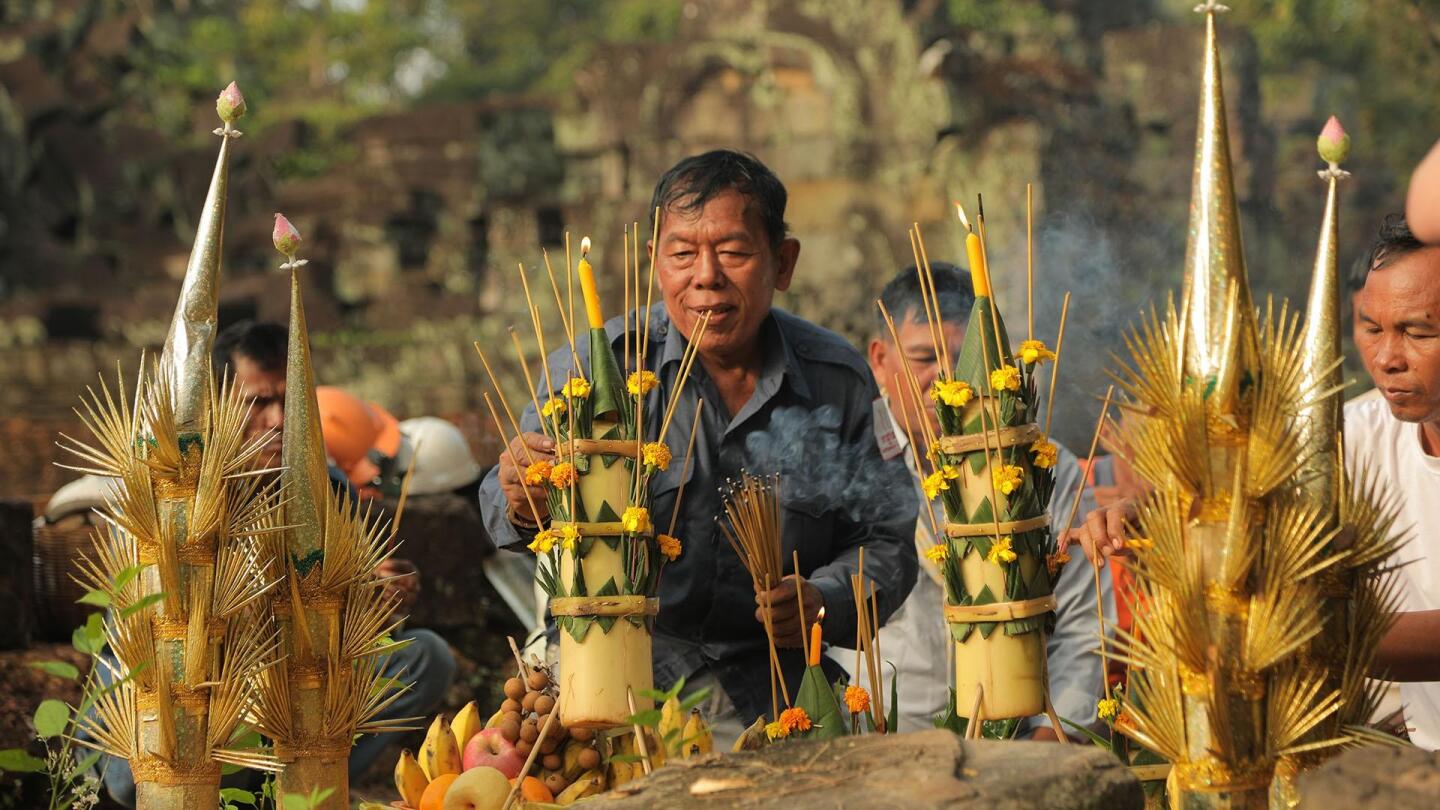 A man prepares an incense tower. | From "Earth's Sacred Wonders: House of the Divine"