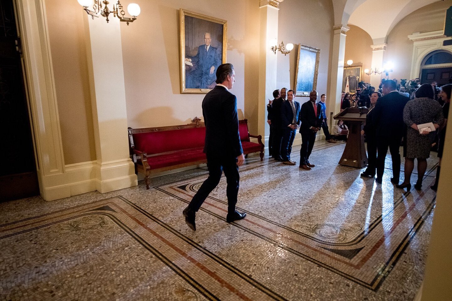 Governor Gavin Newsom, walking towards podium for news conference on March 13th, 2019